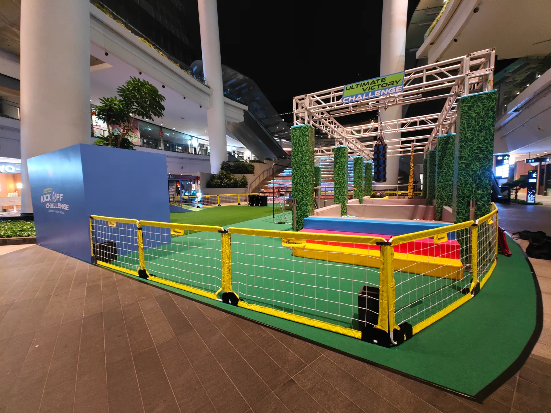Football fencing and truss structures around the mall atrium activation