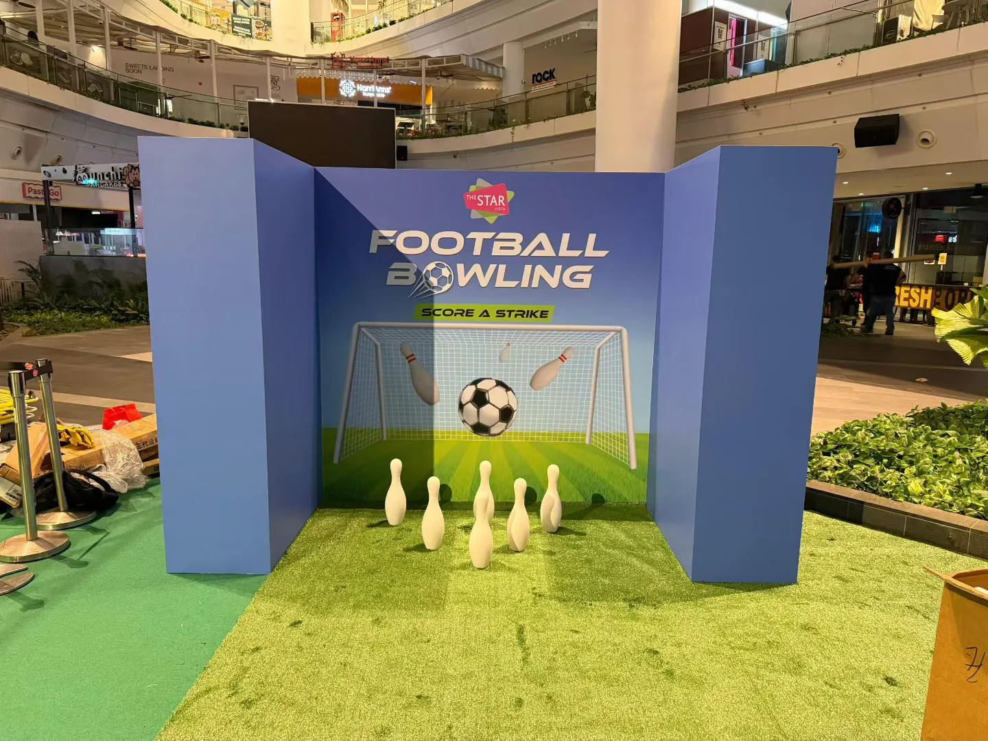 Football bowling prop with ball and pins