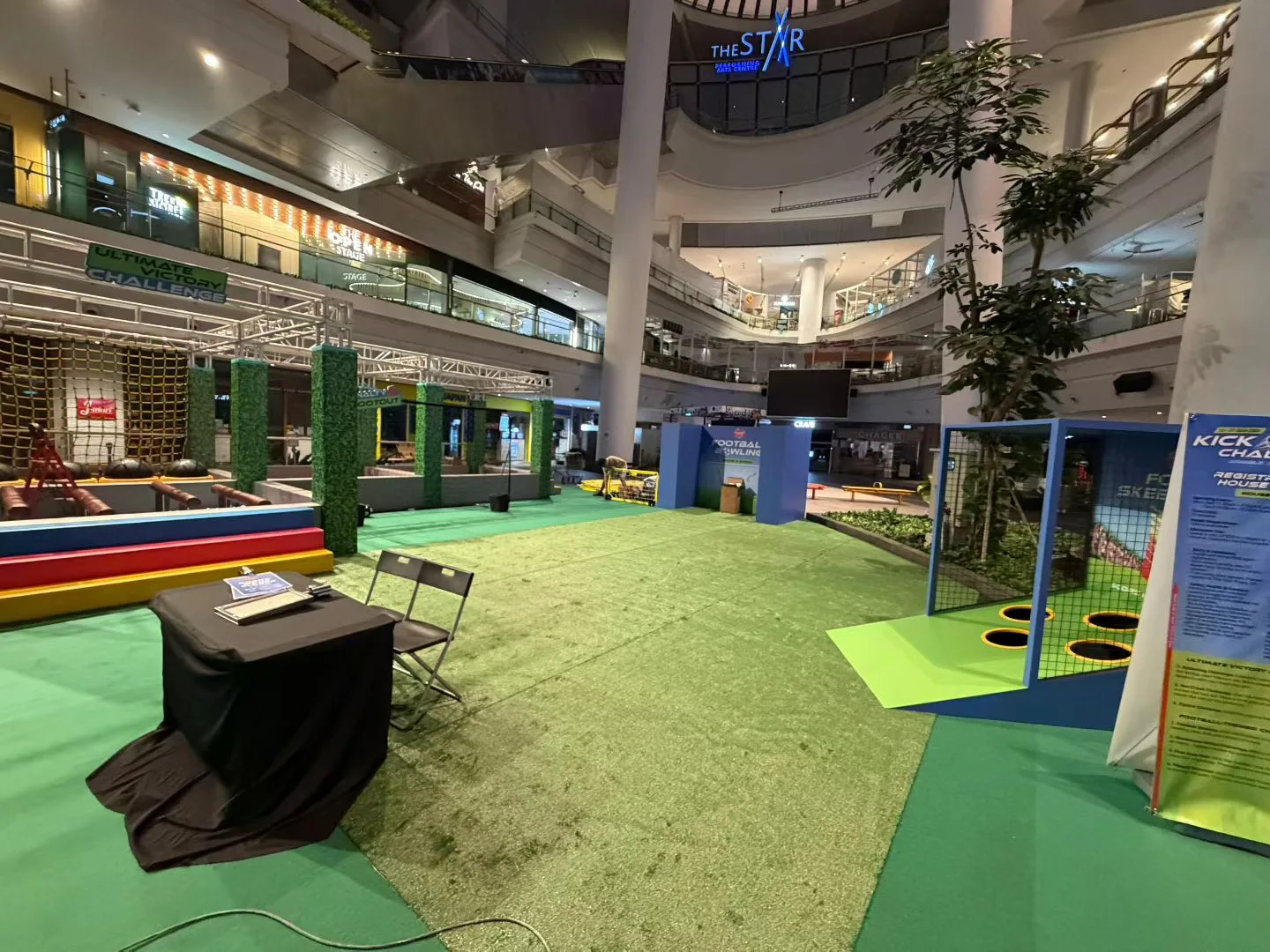 Ground-level view of the Kick Off Challenge carpet and activity zones
