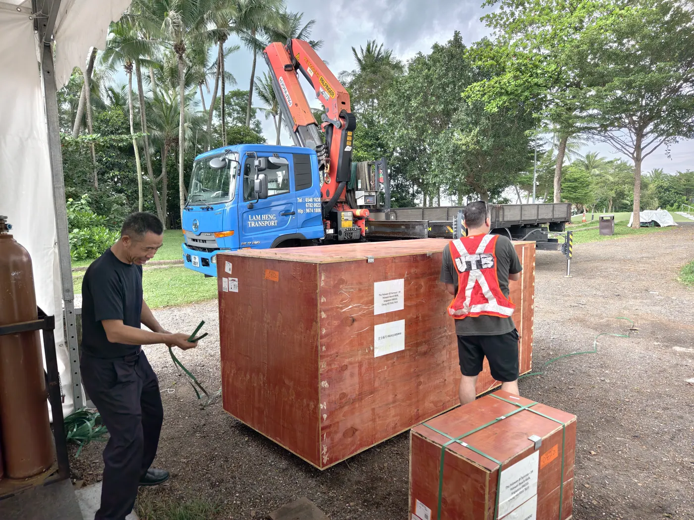 Crane and crates during on-site assembly at Sentosa