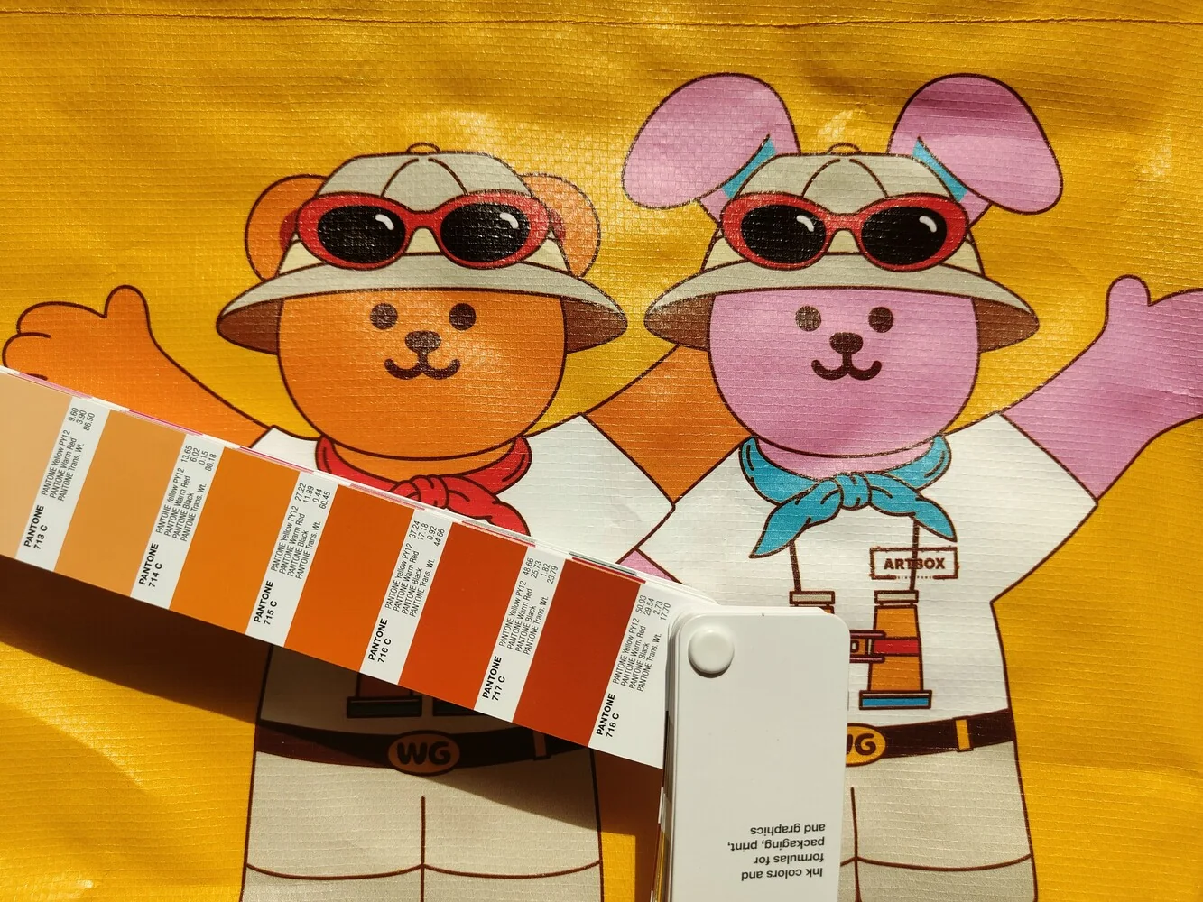 Shopping bag sample compared against Pantone colour cards