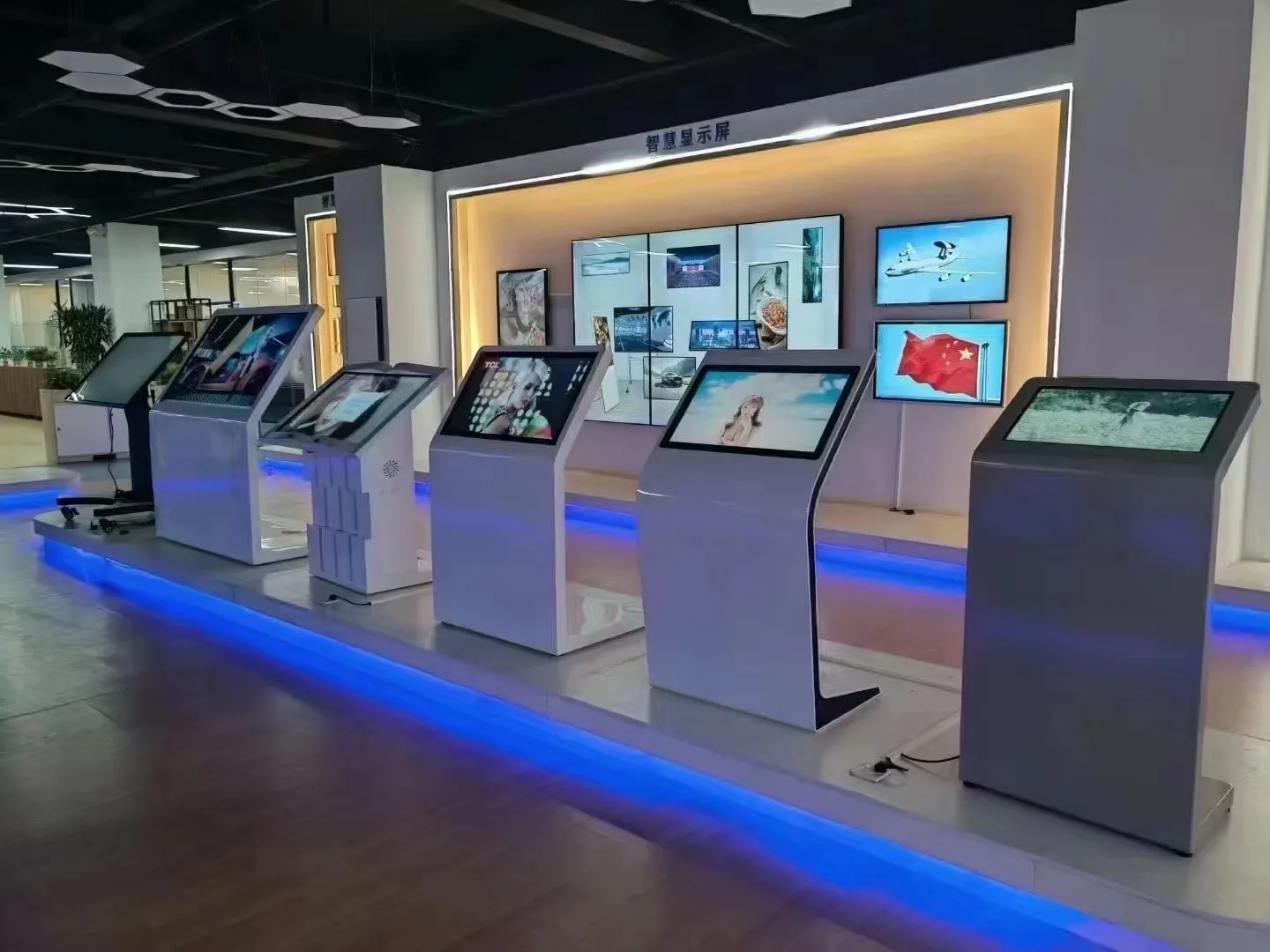 Interactive touchscreen kiosks and digital display wall supplied as technology reference
